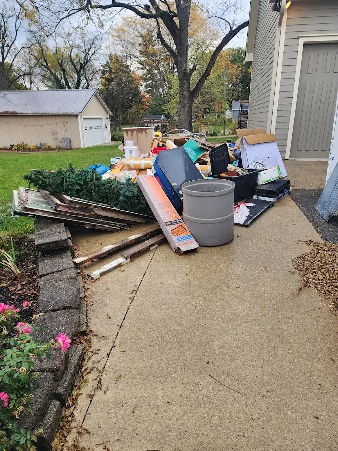 Dumpster being loaded with debris for Roofing Dumpster Rental in Crafton